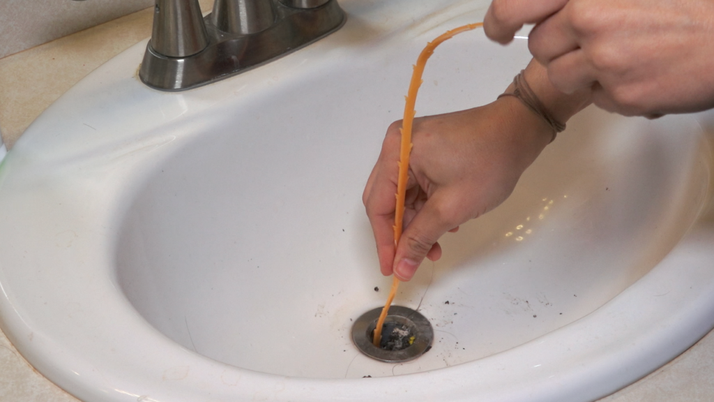 removing a stuck bathroom sink drain